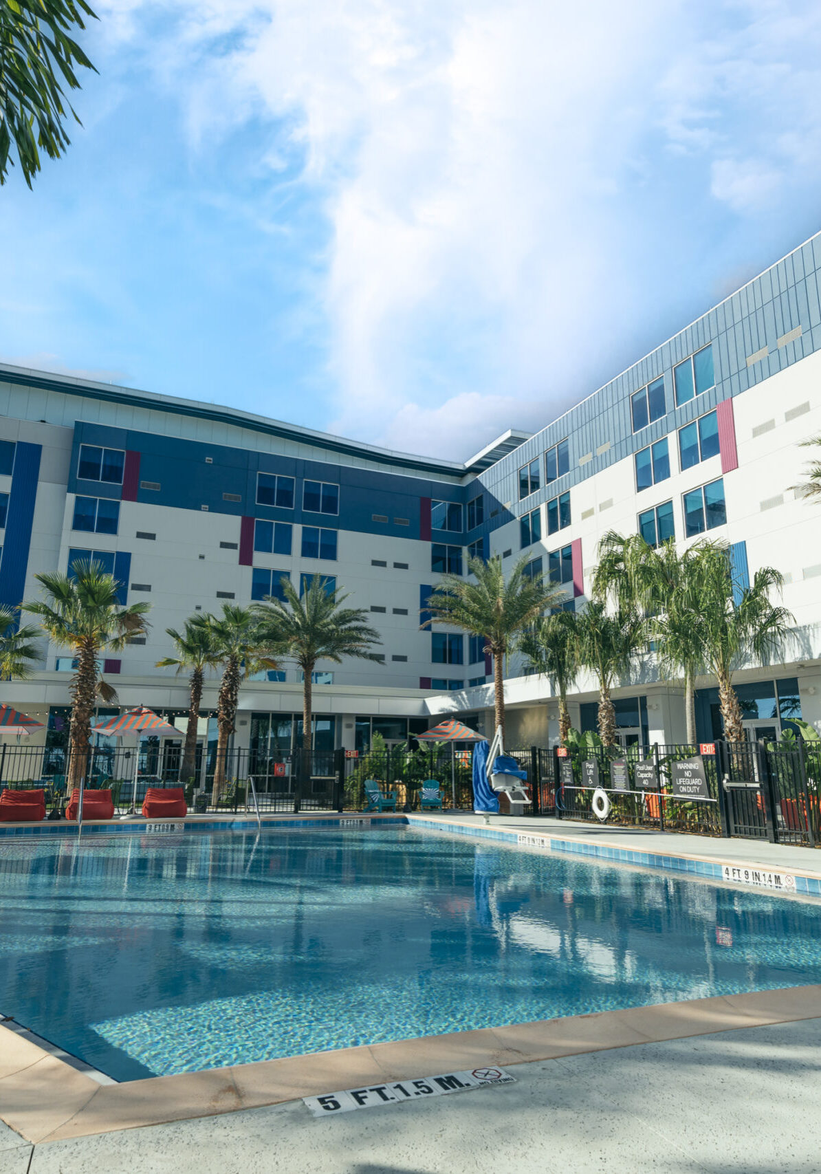 Pool next to hotel building